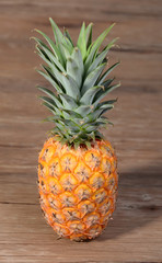 Pineapple on wooden grunge background