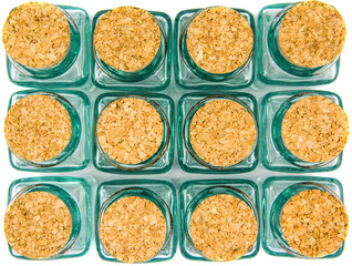 Cork stopper and small glass bottle with white background