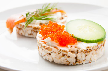 Appetizers with red fish and red caviar
