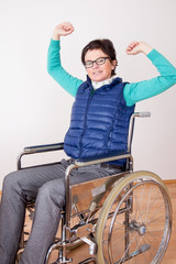 Woman in wheelchair with stretching exercises