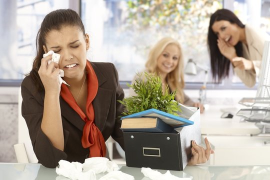 Fired office worker crying at office