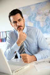 Portrait of businessman sitting in office