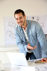 Fototapeta premium Cheerful businessman presenting profession