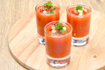 cold tomato soup gazpacho in portion glasses, horizontal