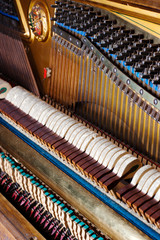 Inside an Upright Piano. Felt Hammers used to strike Steel