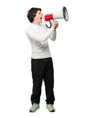 Fototapeta premium Young Man Shouting Through Megaphone