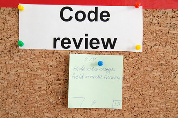 Code review section with paper ticket on cork kanban