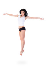 Fototapeta premium Young fitness woman jumping
