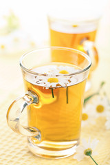 cup of herbal tea with chamomile flowers