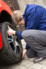 Fototapeta premium Changing a Wheel