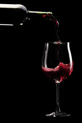 Red wine being poured into a glass