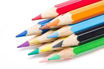 Close up of color pencils isolated on white background.