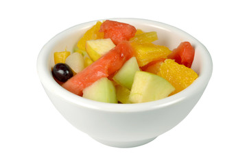 Fresh fruit salad in a bowl on a white background.
