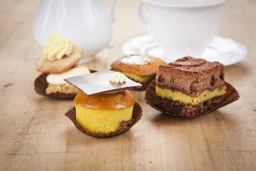 delicious cupcake pastry on wooden background table