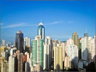 Naklejka premium Skyscrapers in Hong Kong with sun 2
