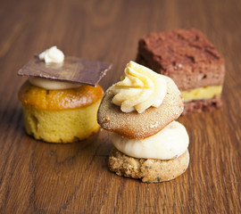 delicious cupcake pastry on wooden background table