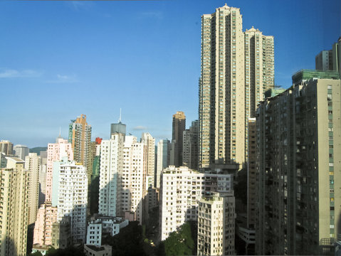Skyscrapers in Hong Kong with sun