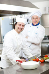 Portrait of two chefs in a restaurant kitchen