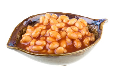 Marinated haricot beans in tomato sauce with shallots on a plate