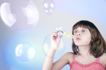 blowing soap bubbles