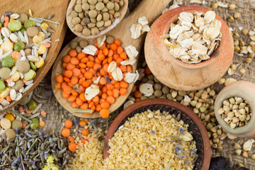 Wooden spoons with different kinds of groats