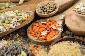 Wooden spoons with different kinds of groats