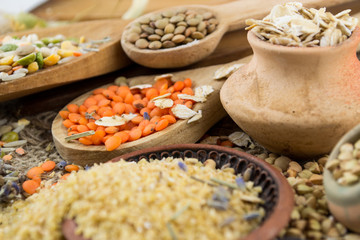 Wooden spoons with different kinds of groats
