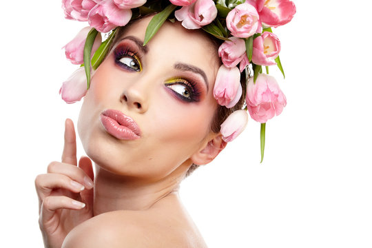 beauty woman portrait with wreath from flowers on head over whit