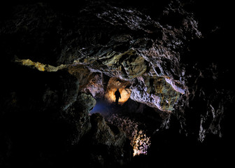 Caver in a cave, Pugnetto, Mezzenile, Piedmont, Italy
