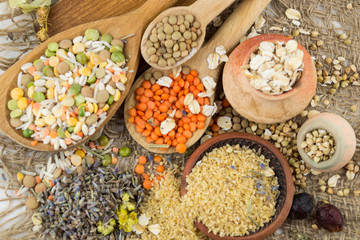 Wooden spoons with different kinds of groats