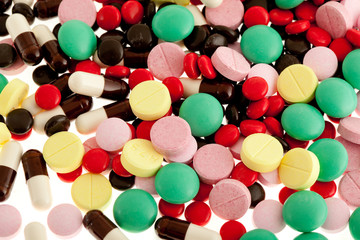 lots of pills on white background