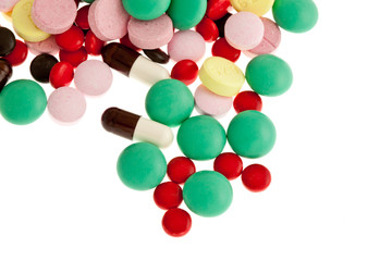 lots of pills on white background