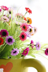 Colorful is Flowers in a Green vase.