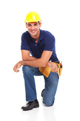 male constructor kneeling