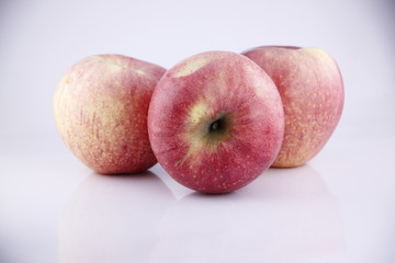 Three Red apple on white background.