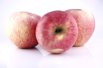 Three Red apple on white background.