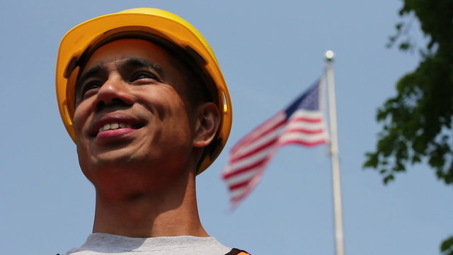 Proud worker in front of American flag