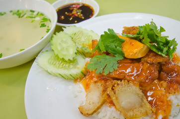 Barbecued pork and crispy pork in red sauce with rice