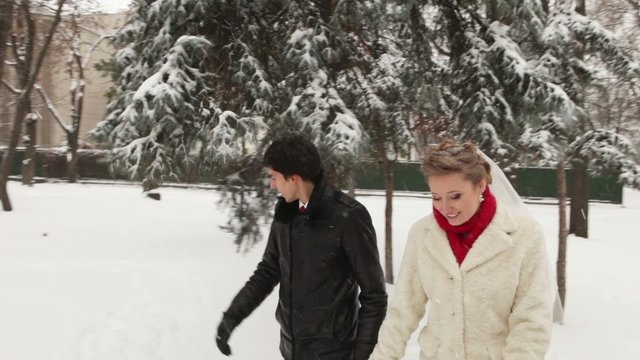 Couple walking in a winter park