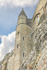 Fototapeta na wymiar Fortress walls abbey of Mont Saint Michel. Normandy, France