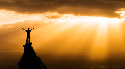 man on the top of a rock