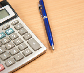 pen and notebook on the wood table