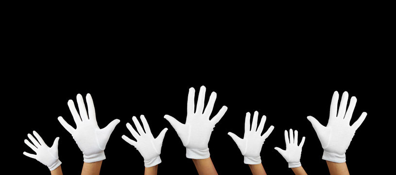 a lot of white hands against black background