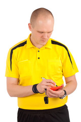 Football referee writing on red card