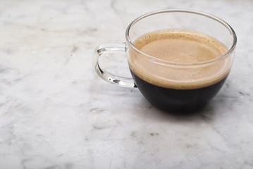cup of italian coffee isolated on marble