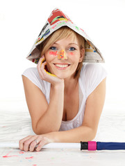 Pretty woman with paint roller renovating her appartment