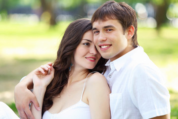 Young love Couple smiling under blue sky