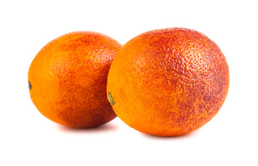 Two blood red oranges