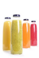 Bottles of fruit juice isolated on white background