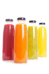 Bottles of fruit juice isolated on white background